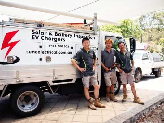 Sune Elelctrical team standing by a work vehicle after finishing a solar batter installation | Featured image for the Solar Batteries Brisbane service landing page.